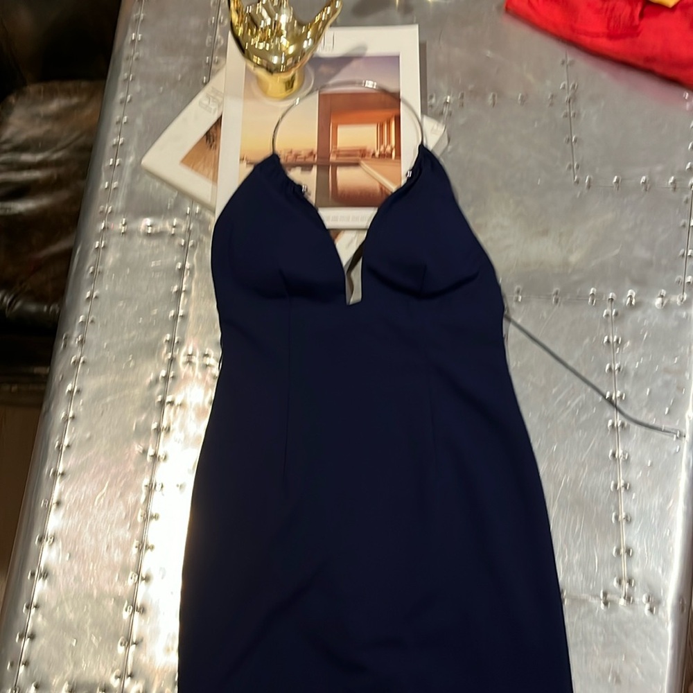 Company Aiden is size 0.Never  worn navy blue. Included hanger